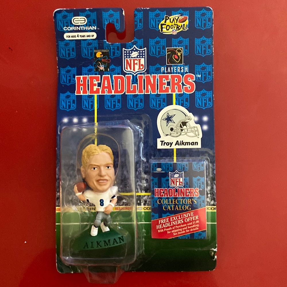 NIB Troy Aikman figurine. Approximately 3” high. New in box.